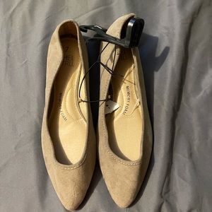 Brand new small slip on size 7 tan flats